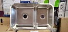 Signature Hardware 34" Calverton Low Divide Double Bowl Stainless Steel Sink Open. Price: $270.00.