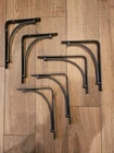New Pair Rubbermaid 1U84 Angle Shelf Brackets Wall Used. Price: $45.00.