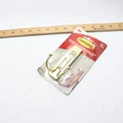 Command Large Double Wall Hooks, Satin Brass, Damage Free Decorating, 1 Open. Price: $7.79.