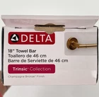 Delta Trinsic 75918-CZ 18" Wall Mounted Towel Bar Champagne Bronze New. Price: $52.88.