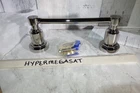 Signature Hardware Greyfield Pivoting Toilet Paper Holder Polished Nickel Open. Price: $95.00.