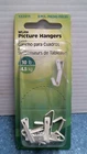Hillman White Picture Hangers 8 Pk (122311) Fs Open. Price: $10.00.