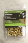 42083 Hillman Brass-plated Standard Steel Lb. 50 Pk Picture Hanger Packs Open. Price: $18.63.